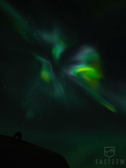 From Reykjavik: Northern Lights Tour with Hot Cocoa & Photos - What happens at the outdoor stops