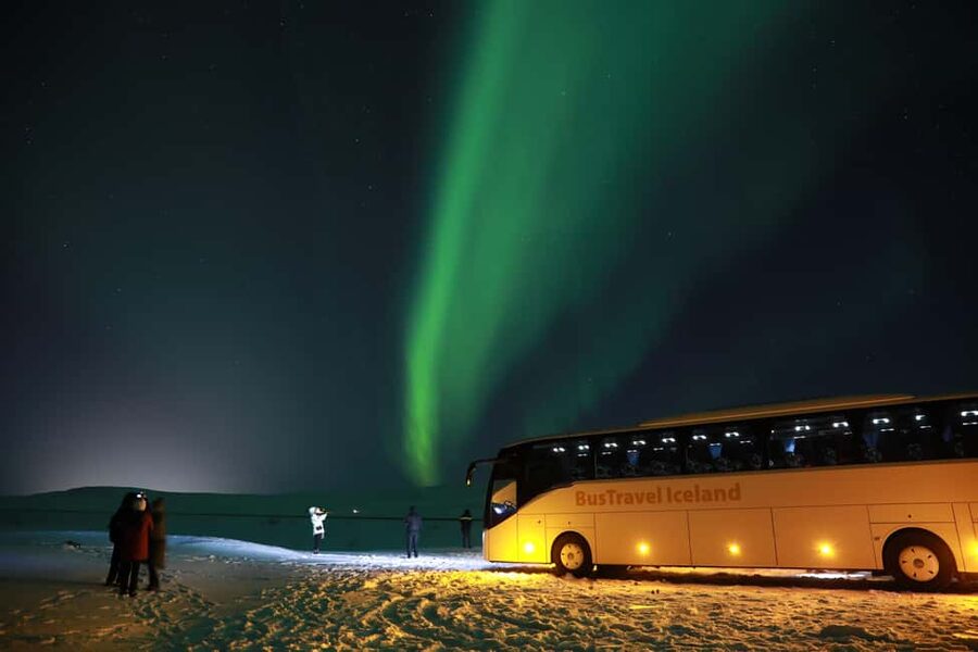 Iceland: Northern Lights Bus Tour from Reykjavik - Waiting under a changing Icelandic sky