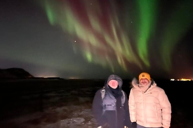 Northern Lights Private Guided Tour With Professional Photos - Waiting beneath Iceland’s dark sky