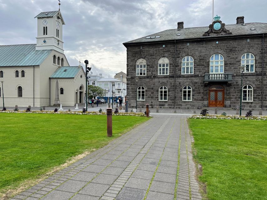 Reykjavik: City Walking tour in Small Group with Local Guide - Alþingi and Austurvöllur explain the civic center