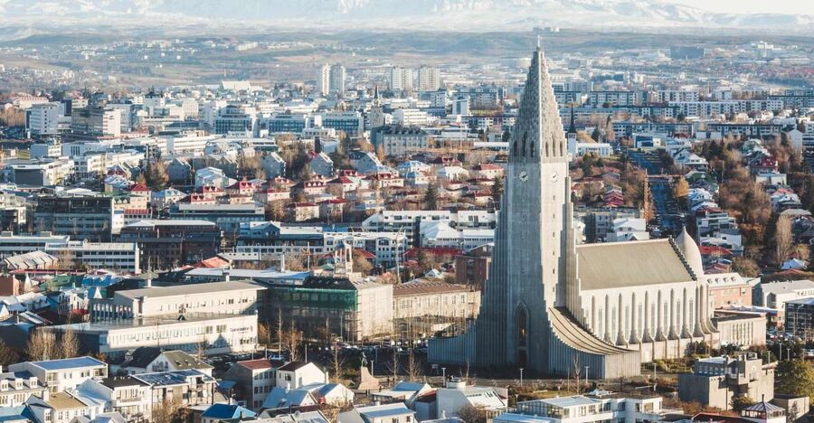 Reykjavik: Panoramic Helicopter Flight with Summit Landing - The first views: rooftops, churches, and the harbor