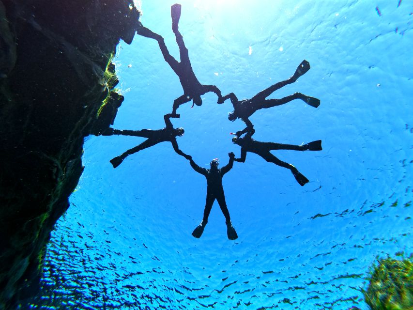 Silfra: Half-Day Snorkeling Day Trip with Underwater Photos - Getting into the drysuit