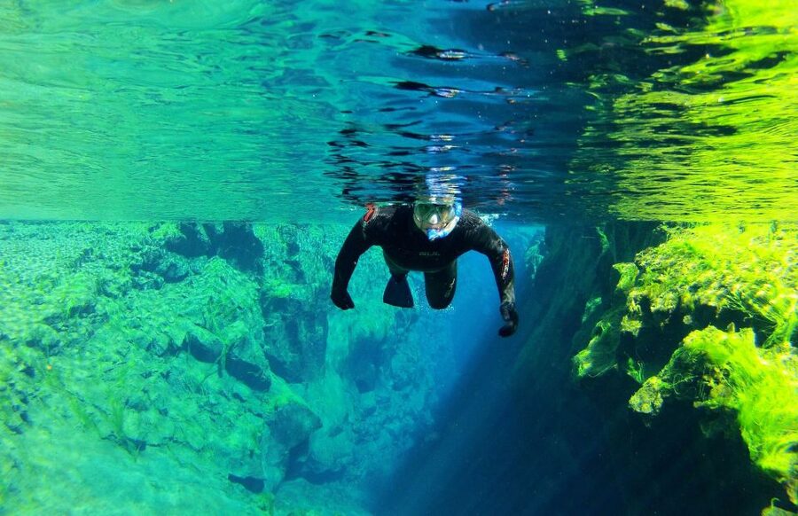 Silfra: Half-Day Snorkeling Day Trip with Underwater Photos - The safety briefing and first steps into the water