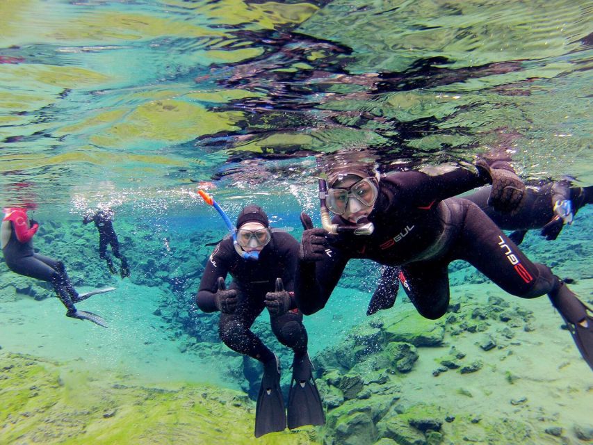 Silfra: Half-Day Snorkeling Day Trip with Underwater Photos - Floating through the blue rift