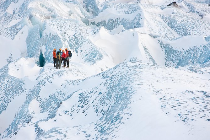 Sólheimajökull Glacier Hike & Ice Climbing Intro - Small Group - Walking across crevasses, ridges, and blue ice